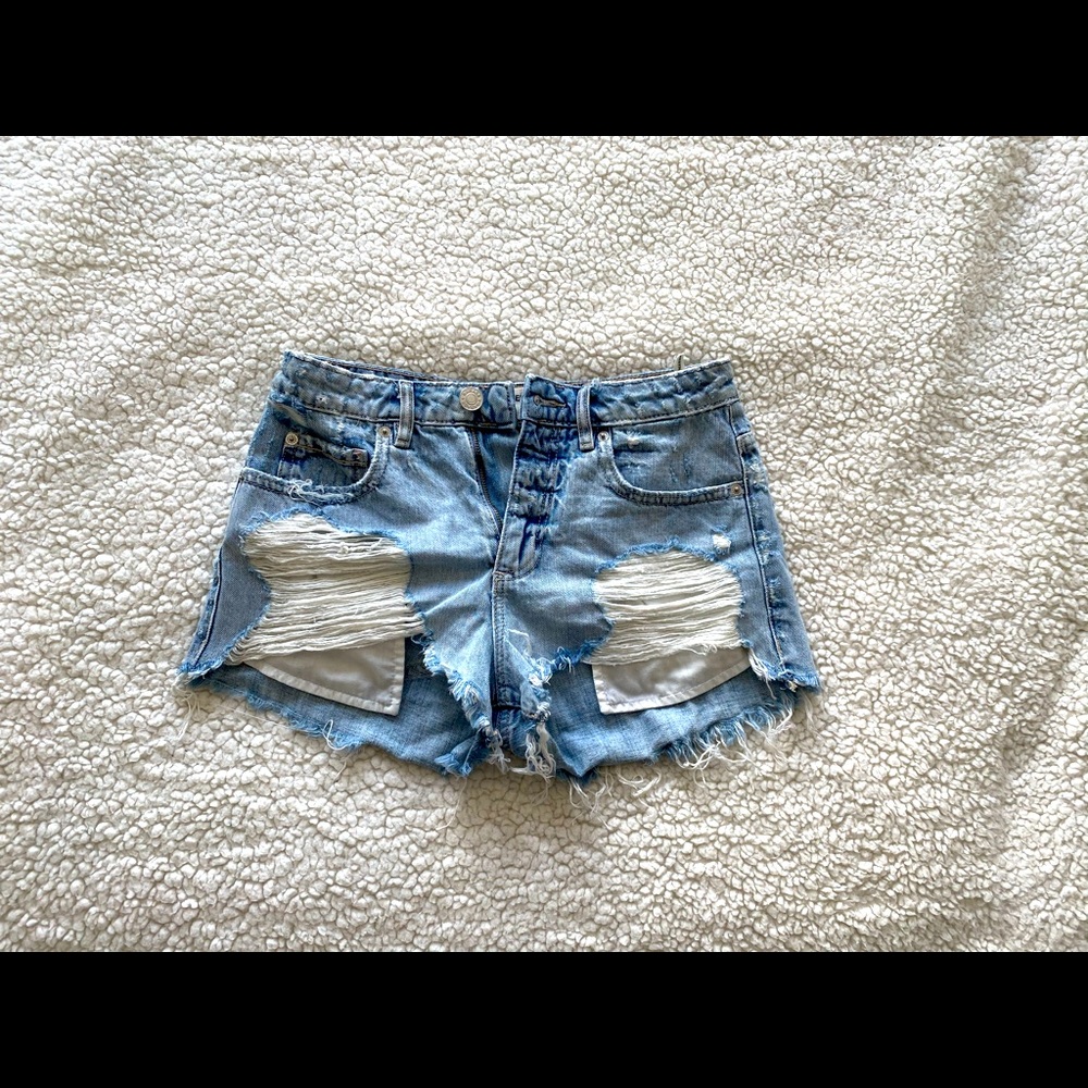 Ripped blue Jean shorts from Garage. 11/10🔥🔥